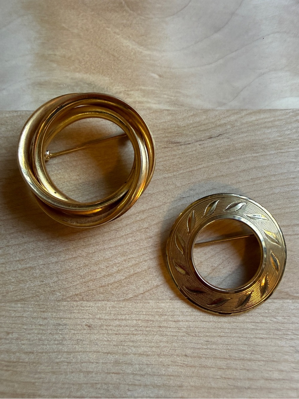 Vintage Gold Tone Circle Brooch Pair Intertwined Rings and Engraved Leaf Mid Cen